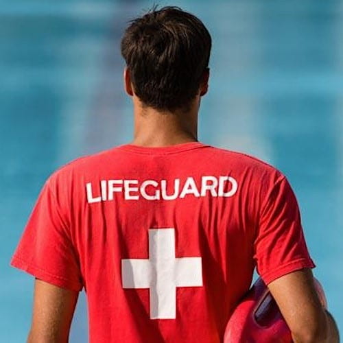 back of lifeguard with red shirt on