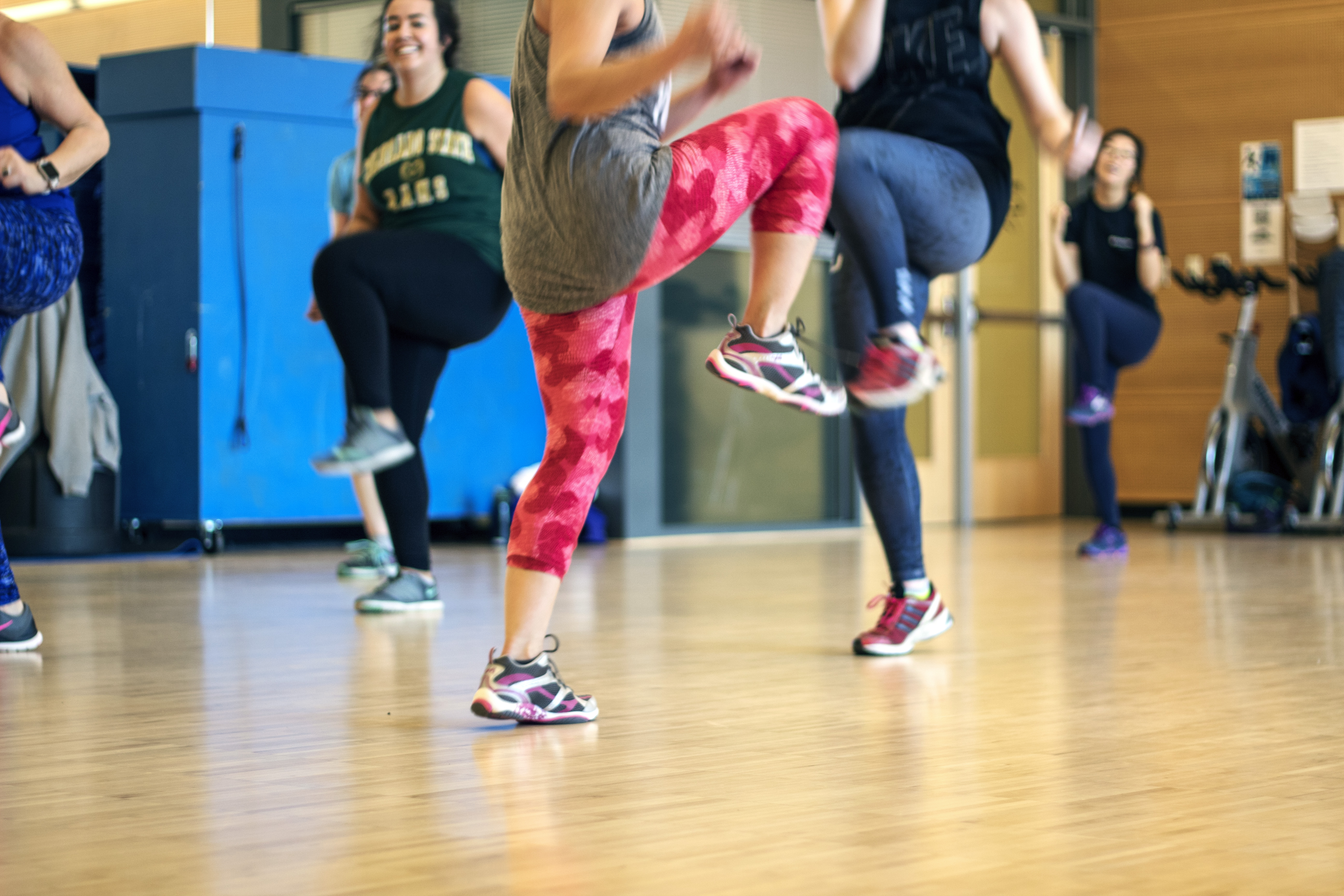 group of people doing Zumba in a fitness studio in the WWU Rec Center