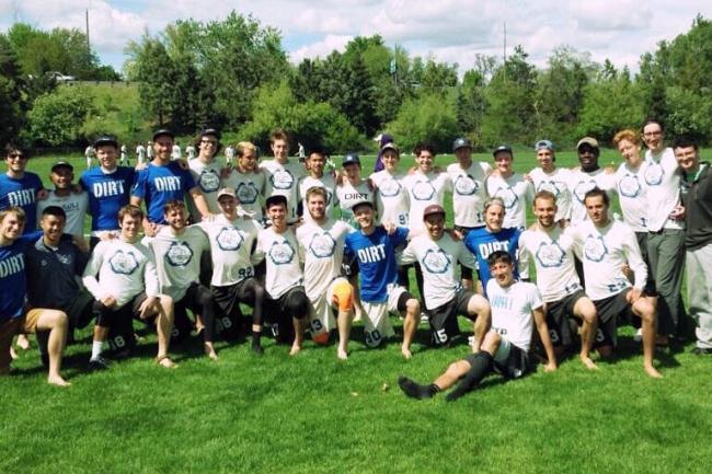 men's ultimate team posing for group photo on grass